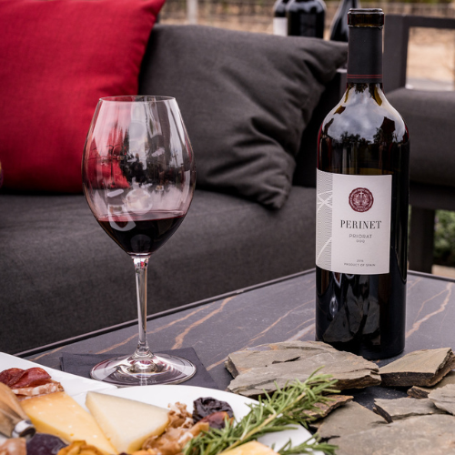 Perinet Wine on table with cheese board