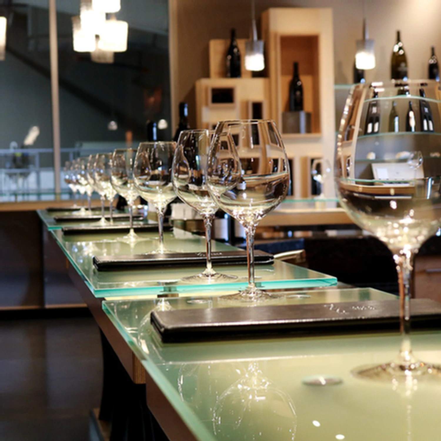 Wine glasses laid out for an indoor tasting at Tolosa Winery
