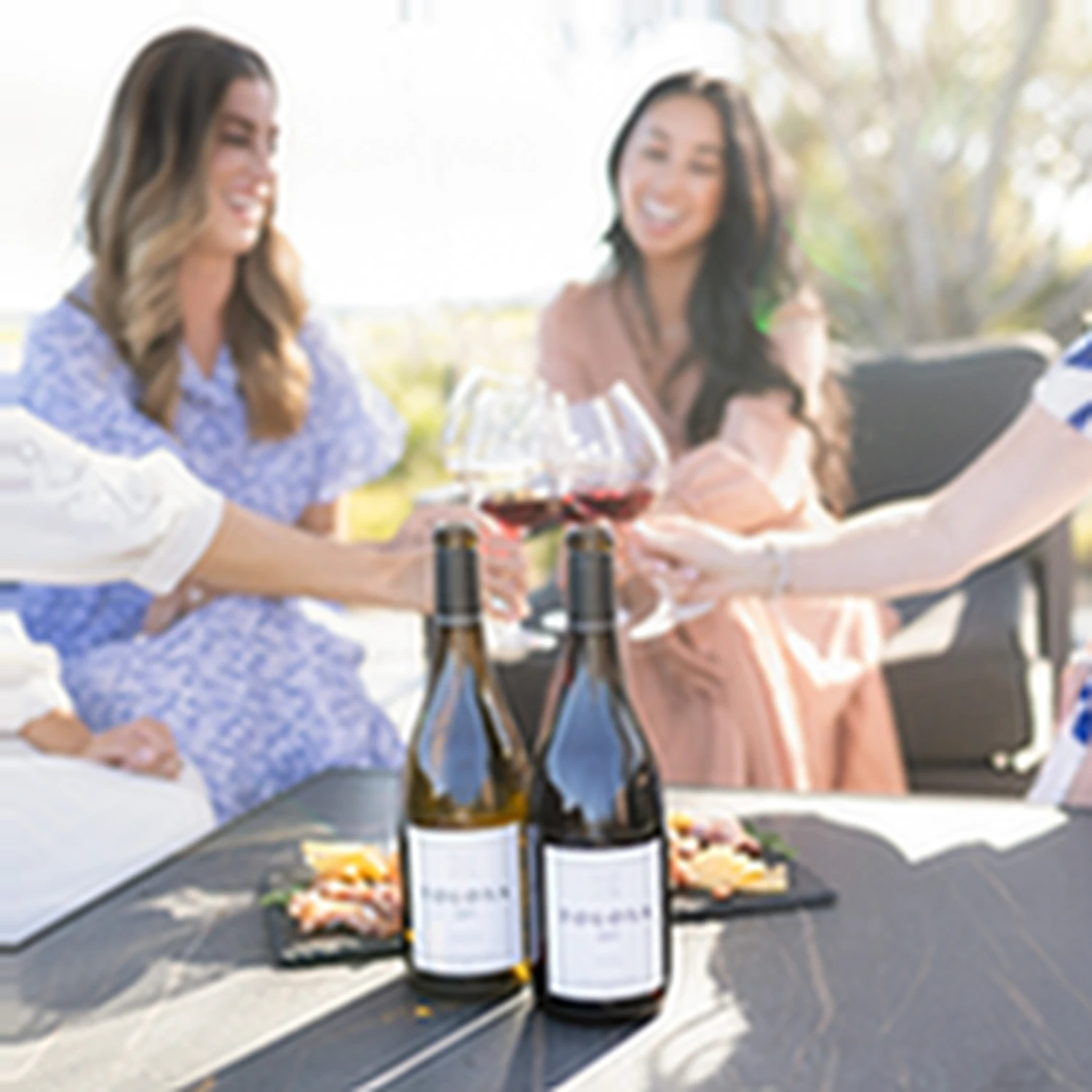A group enjoying a tasting in the outdoor seating area